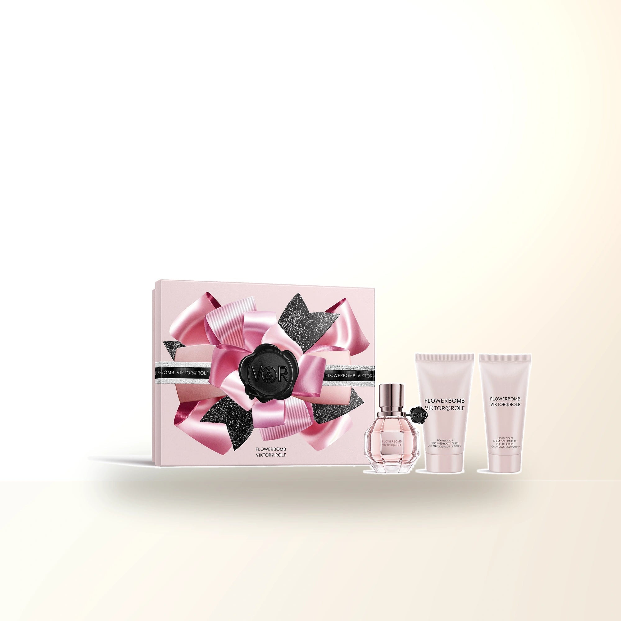 Flowerbomb 3 Pcs Set For Women: 1 Oz Eau De Parfum Spray + Bomblicious 1.7 Body Lotion + Bomblicious 1.36 Body Cream main product image