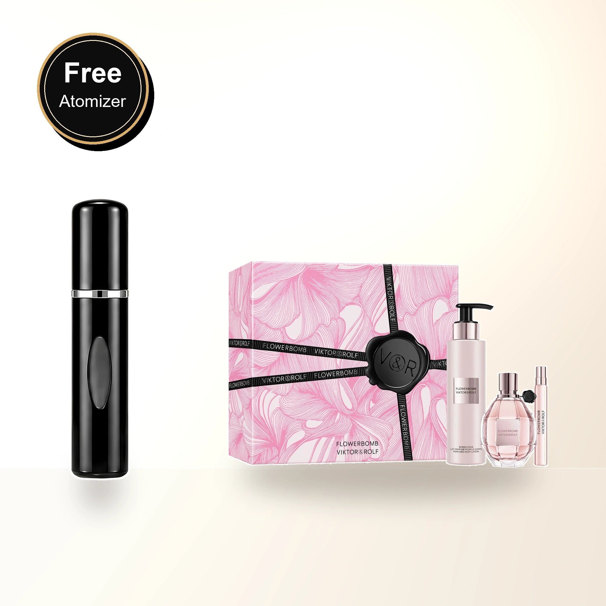 Flowerbomb 3 Pcs Set For Women: 3.4 Eau De Parfum Spray + 0.34 Eau De Parfum Spray + 6.7 Body Lotion with free atomizer bonus image